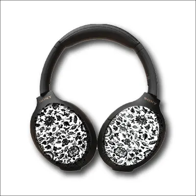 Over the ear headphones with a black and white floral protective cover